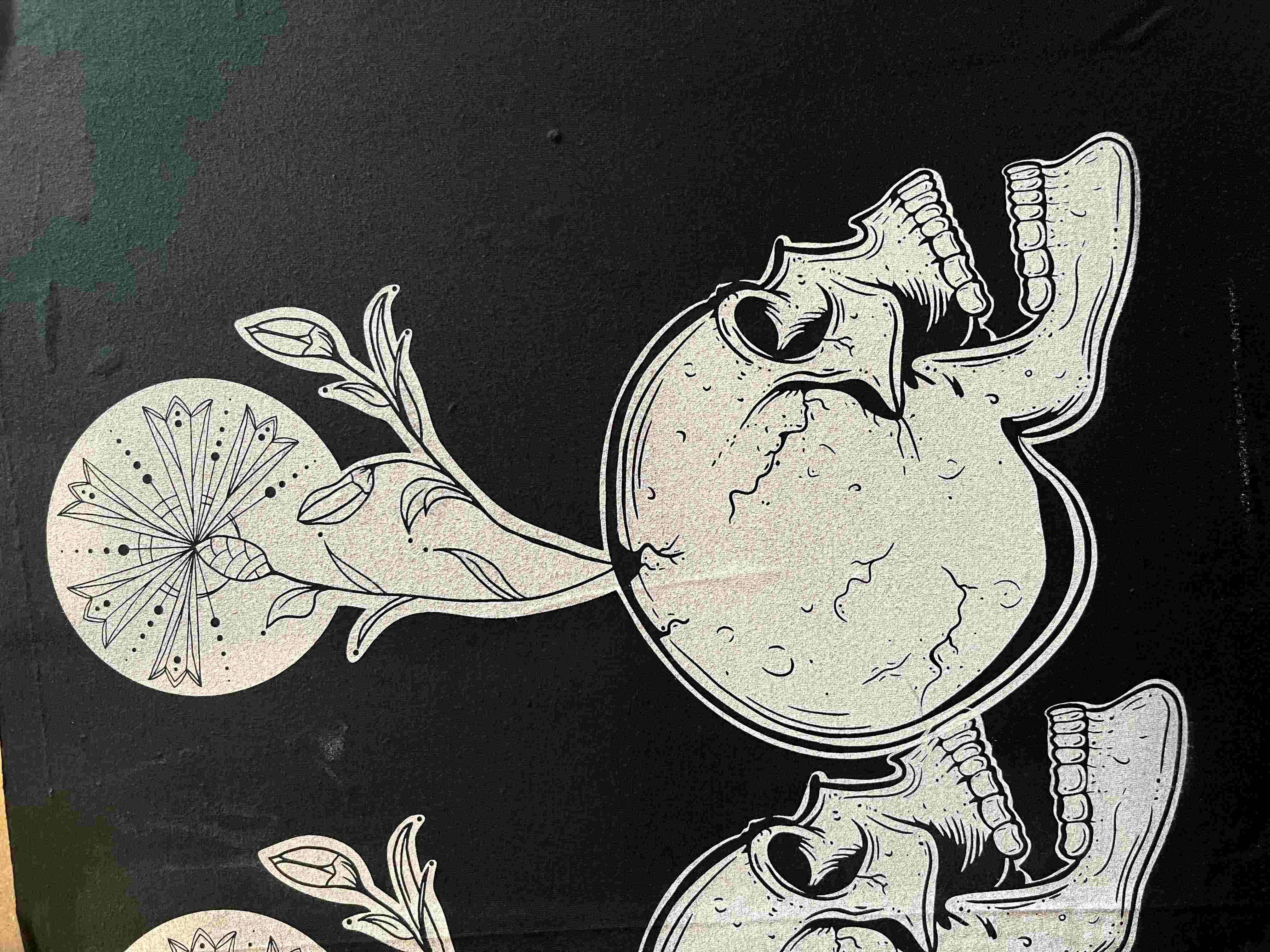 Black shirt with artistic skull and flower design